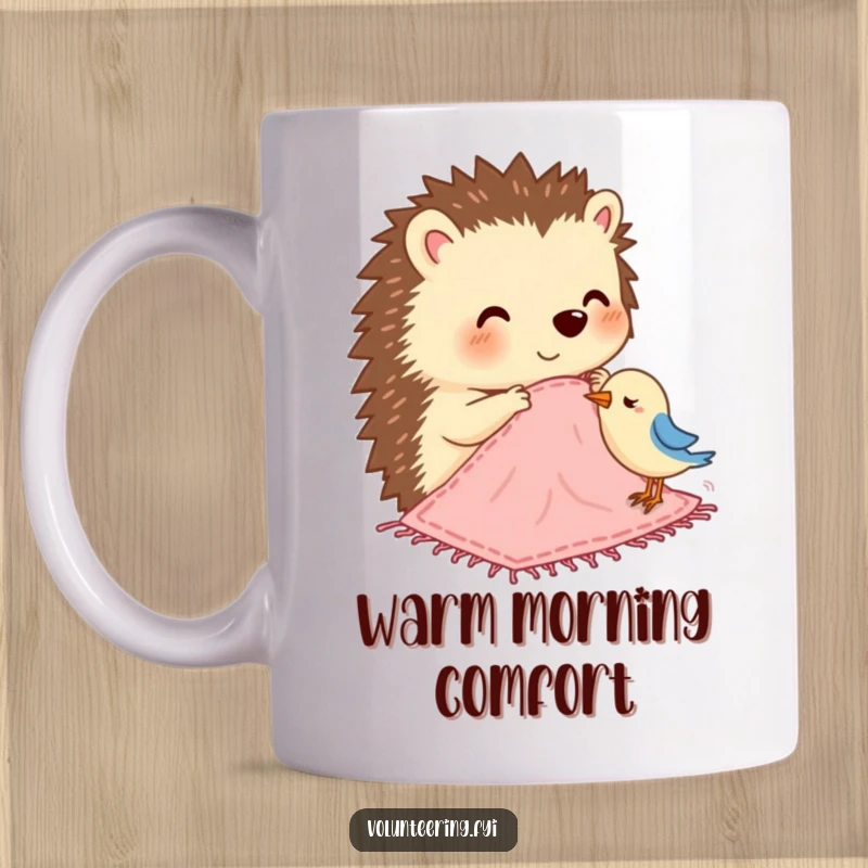 Funny mug depicting a smiling hedgehog carefully stitching a small, colorful blanket for a tiny bird.