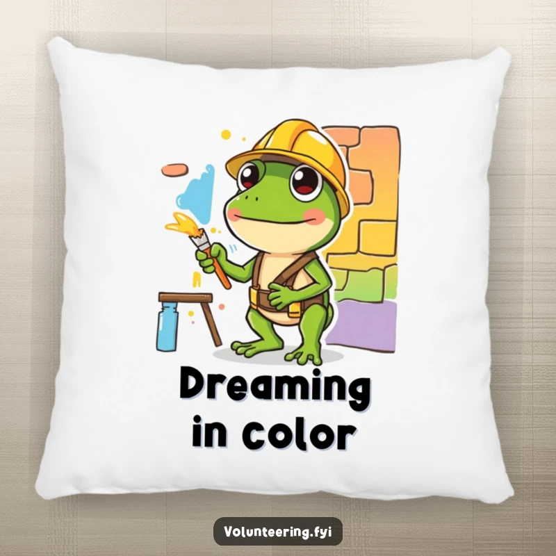 Funny pillow featuring a diligent green frog with a hard hat painting, offering comfort and a splash of artistic humor.