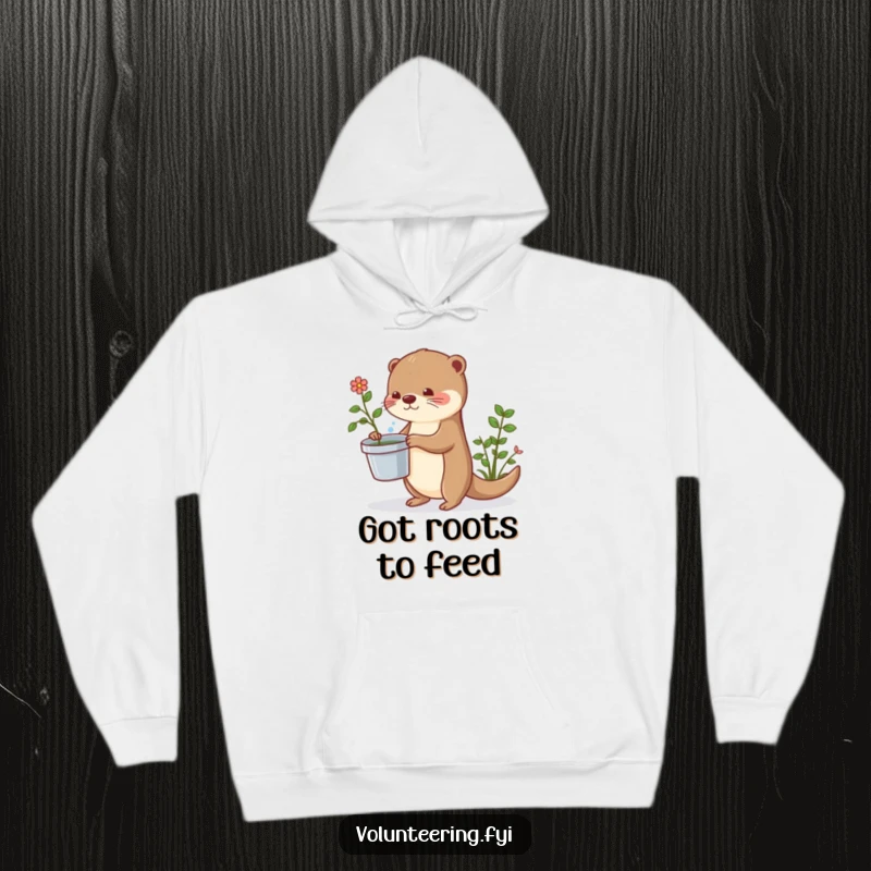 Funny otter hoodie showing a cute otter diligently watering plants, radiating warmth and playful charm.
