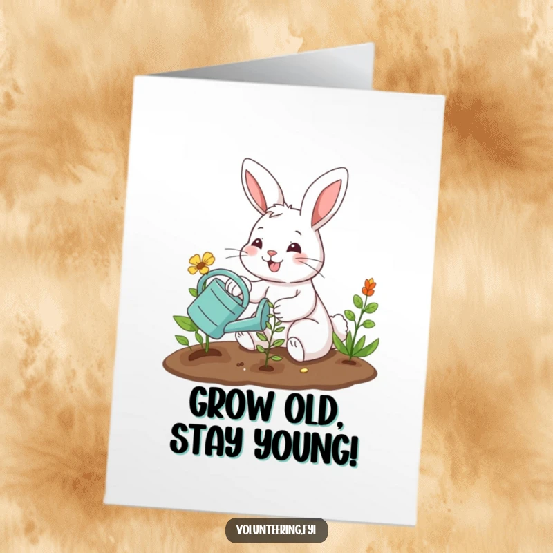 Funny free printable birthday card: smiling bunny plants a seedling with a watering can, celebrating growth and joy.