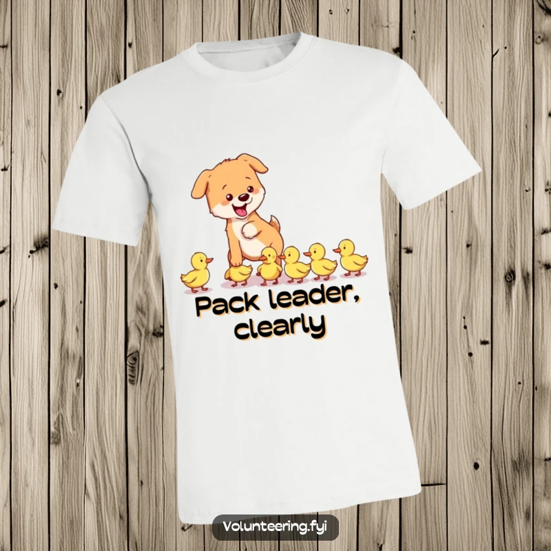 Funny dog t-shirt featuring a playful dog gently guiding a group of lost ducklings, a charming scene of animal care.