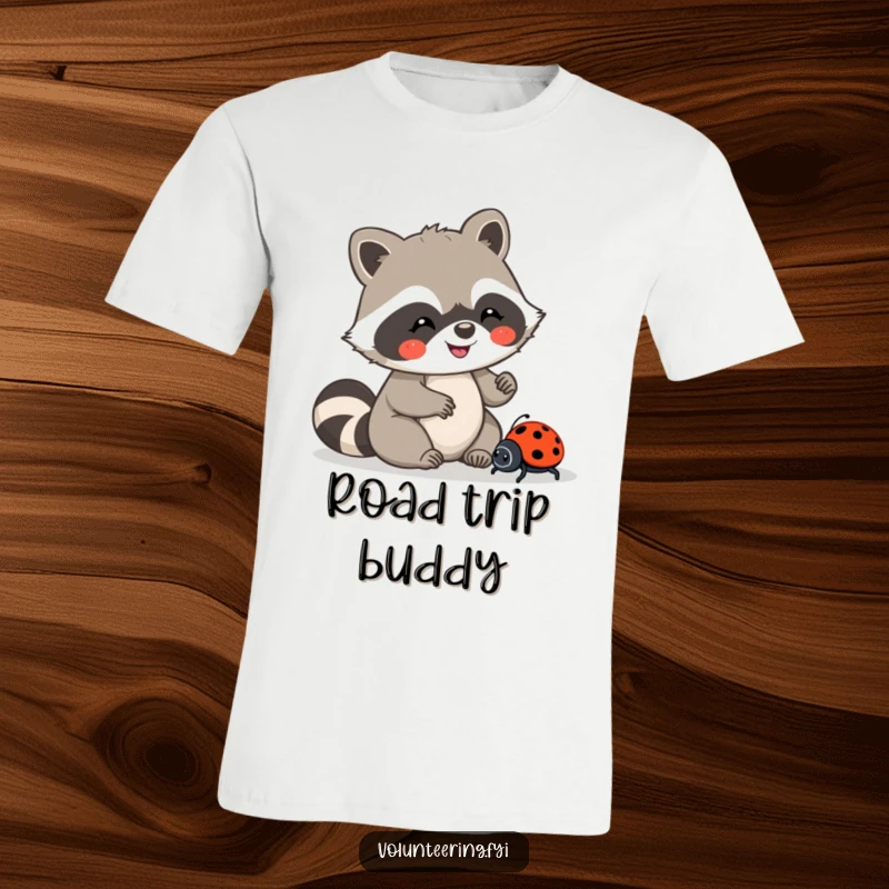 Funny t-shirt featuring a joyful Kawaii raccoon carefully guiding a lost ladybug, promoting kindness, a wonderful funny gift.