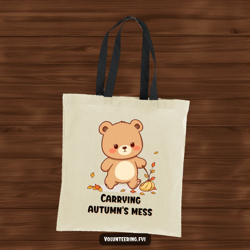 Funny Kawaii bear tidying up fallen leaves, cute tote bag for cleaners.
